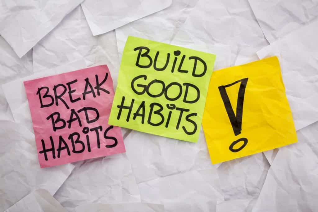 Sticky notes that say break bad habits and build good habits