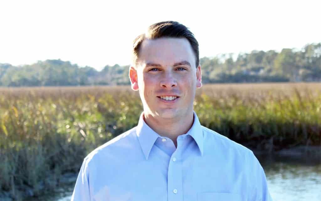 Chris Hervochon in front of a marsh