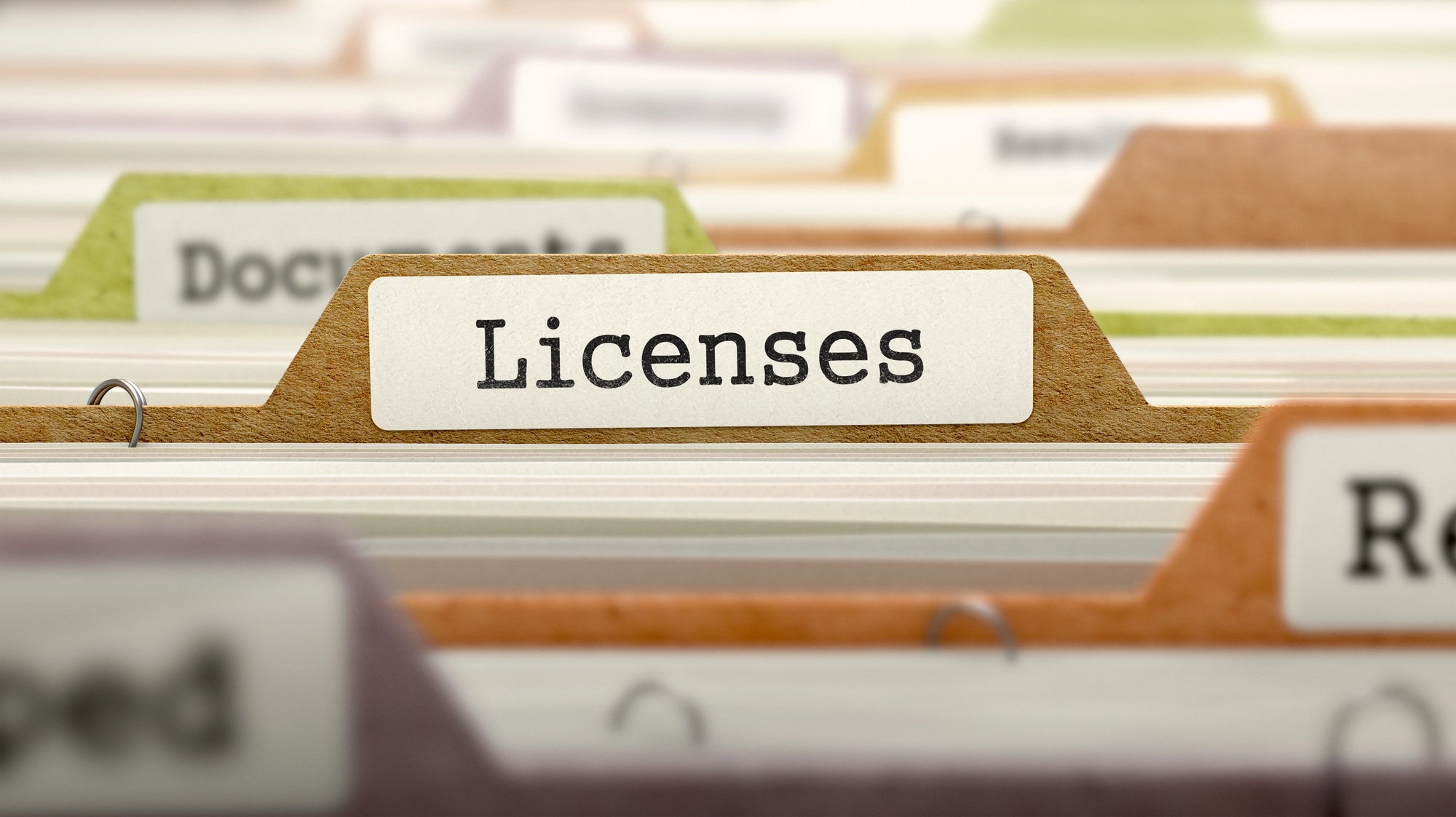 File folders with one that says licenses