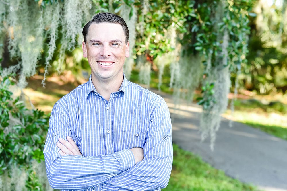 Chris Hervochon in front of a live oak with Spanish moss